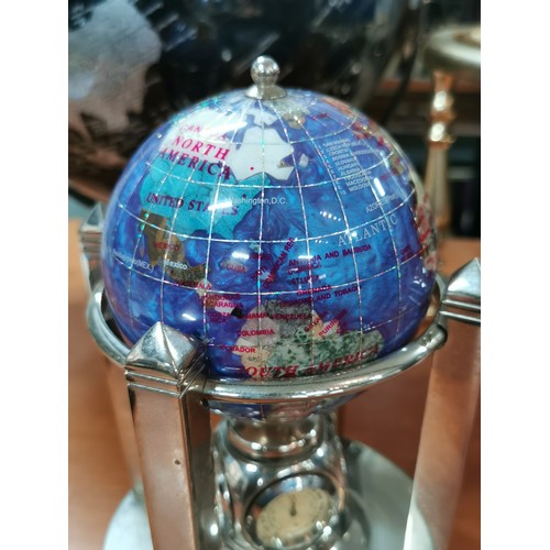 273 - A small inlaid gemstone globe set on a 4 pillar revolving chrome stand with temperature and clock to... 