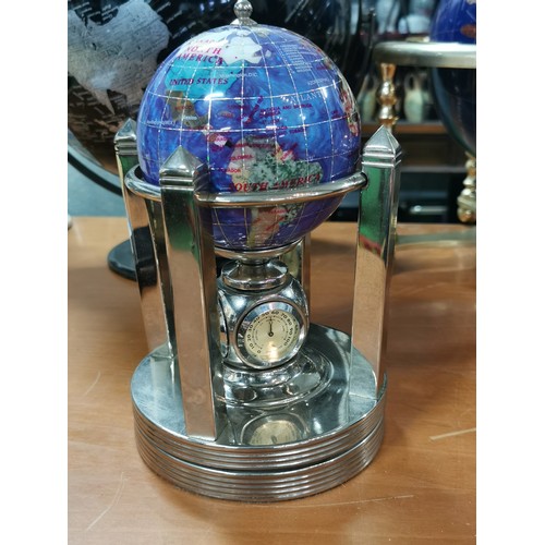 273 - A small inlaid gemstone globe set on a 4 pillar revolving chrome stand with temperature and clock to... 