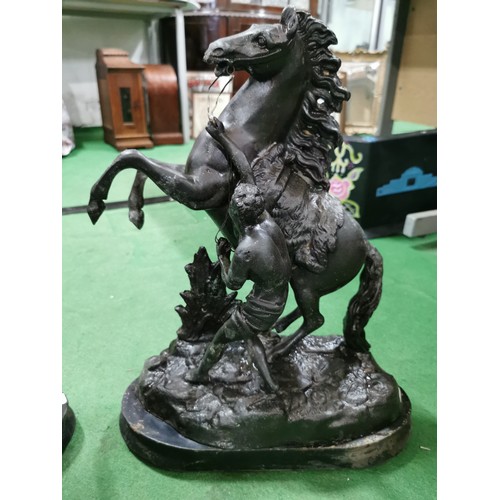 279 - A pair of spelter marley horses in overall good condition standing on wooden bases both are signed h... 