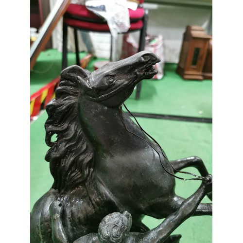 279 - A pair of spelter marley horses in overall good condition standing on wooden bases both are signed h... 