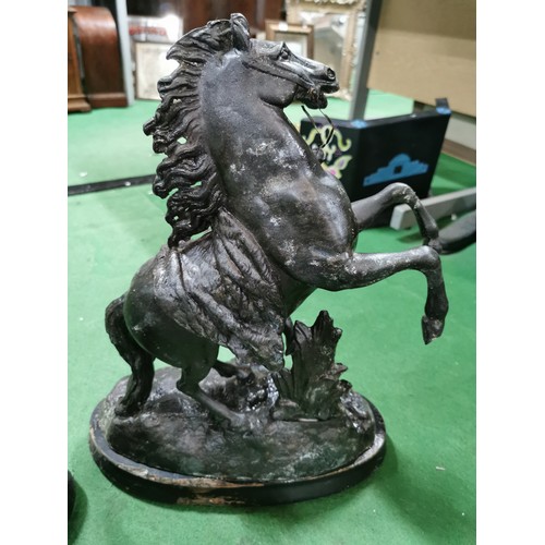 279 - A pair of spelter marley horses in overall good condition standing on wooden bases both are signed h... 