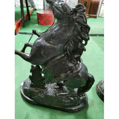 279 - A pair of spelter marley horses in overall good condition standing on wooden bases both are signed h... 