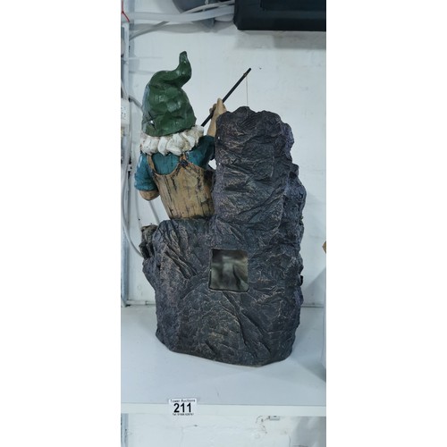 211 - Large fishing garden gnome with his dog rock water feature complete with power supply in good overal... 