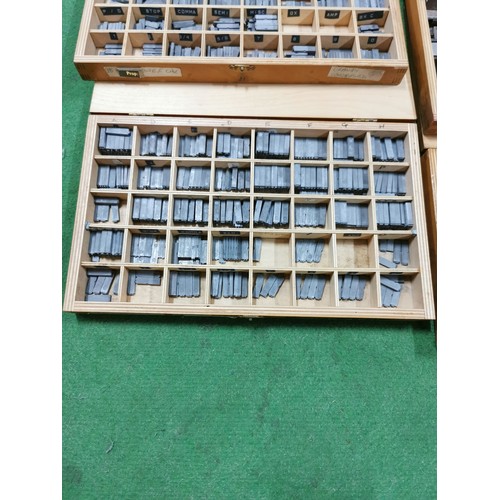 280 - 6 divisional lidded printers boxes along with a 9 divisional box containing a large quantity of meta... 