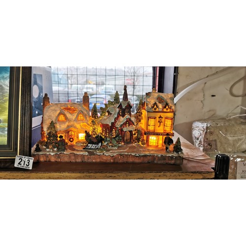 213 - Light up Christmas Village table decoration (plastic) along with a musical light up snow globe (19cm... 