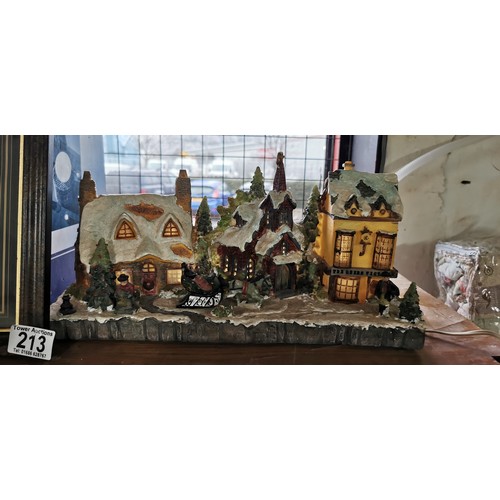 213 - Light up Christmas Village table decoration (plastic) along with a musical light up snow globe (19cm... 