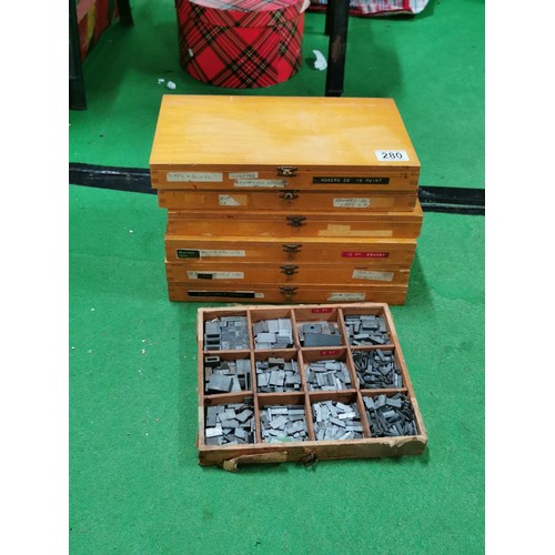 280 - 6 divisional lidded printers boxes along with a 9 divisional box containing a large quantity of meta... 