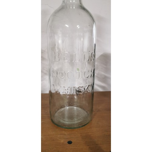 218 - Very large vintage 5 litre Bell's Scotch Whisky bottle in good overall condition along with Laura As... 