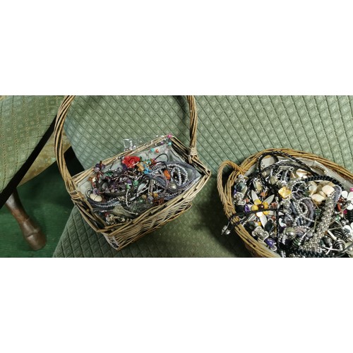 221 - 2x baskets of various costume jewellery - all jewellery is unused