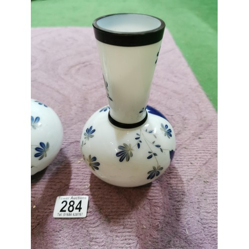 284 - A pair of milk glass hand painting vases with floral design with signature to the base in excellent ... 