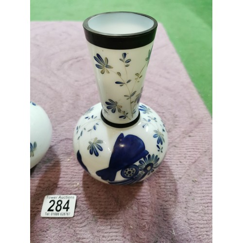 284 - A pair of milk glass hand painting vases with floral design with signature to the base in excellent ... 