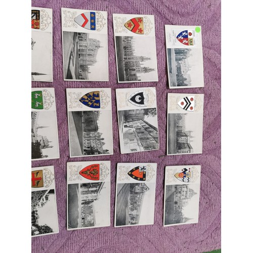 287 - A quantity of 25 university postcards each depicting a coat of arms inc Trinity college, Exeter univ... 