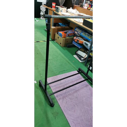 235 - black and chrome collapsible clothes rail, height is adjustable on casters. Height when not extended... 