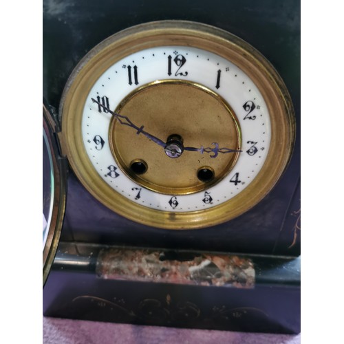 291 - An 8 day french slate clock with marble detail striking on a coiled gong, complete with pendulum and... 