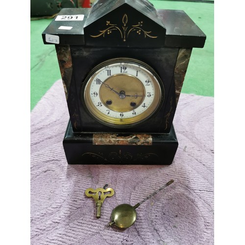 291 - An 8 day french slate clock with marble detail striking on a coiled gong, complete with pendulum and... 