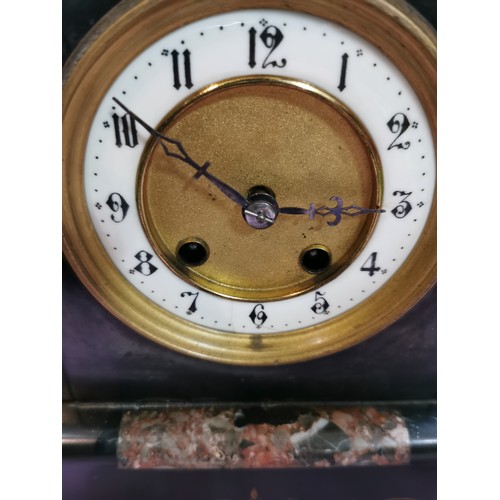 291 - An 8 day french slate clock with marble detail striking on a coiled gong, complete with pendulum and... 