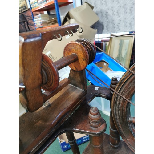 552 - Genuine antique English Rose spinning wheel in full working order complete with leather strapping, a... 