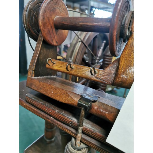 552 - Genuine antique English Rose spinning wheel in full working order complete with leather strapping, a... 