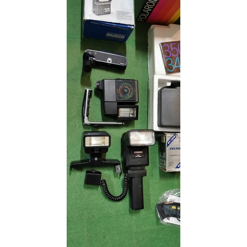 257A - box of various vintage cameras and camera accessories including 2 boxed polaroid cameras