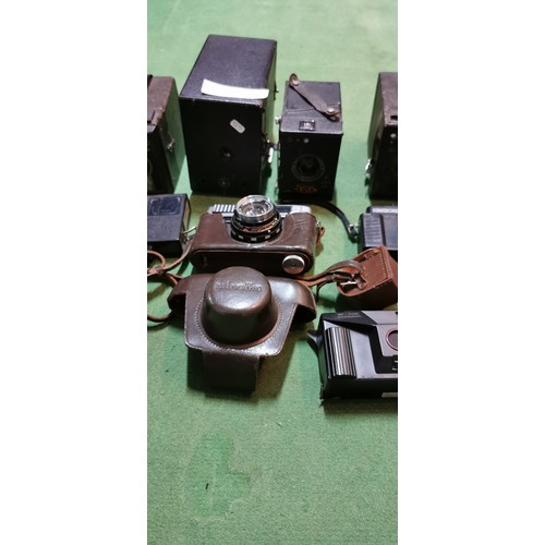 257B - box of various vintage cameras and camera accessories  inc zenit 35mm cameras etc.