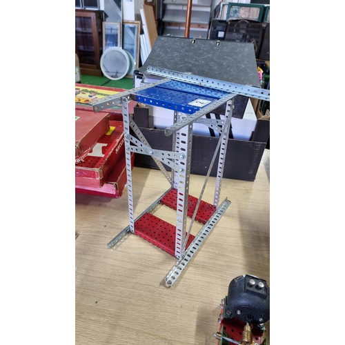 2 - Vintage assembled Meccano structure along with a vintage Meccano 20 volt motor and 1x other geared p... 