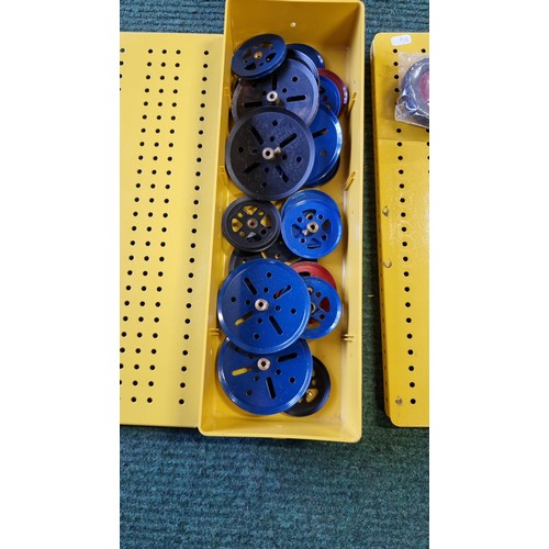 8 - 3x yellow metal  Meccano storage boxes containing pulleys, wheels and axle rods and crank handles al... 