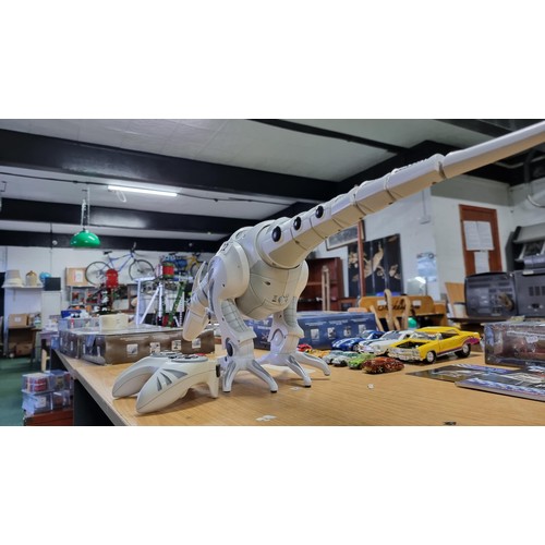 22 - Large remote control dinosaur figure complete with batteries, tested and in full working order. Heig... 