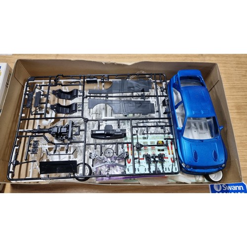 25 - Vintage Tamiya Michelin Pilot Ford Escort RS Cosworth model car kit, unassembled and complete.