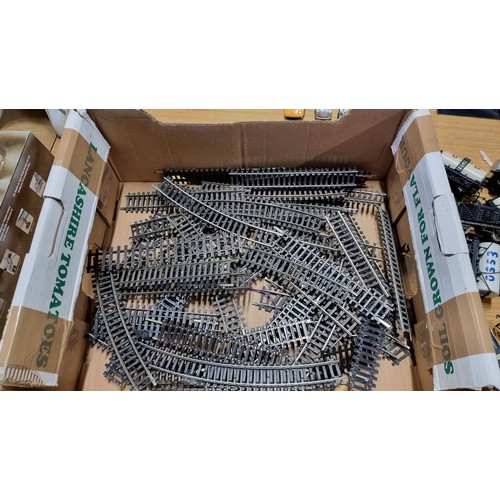 27 - Box full of 00 Gauge train pieces inc Rolling Stock, various straight and curved track and 2x train ... 