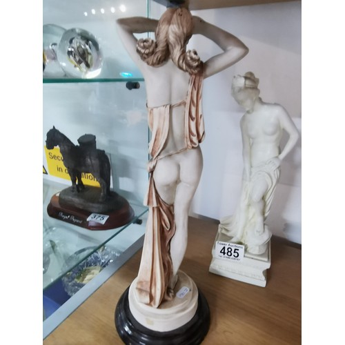 485 - Pair of resin female figures, one on a plinth.
Tallest measures 36cm high.