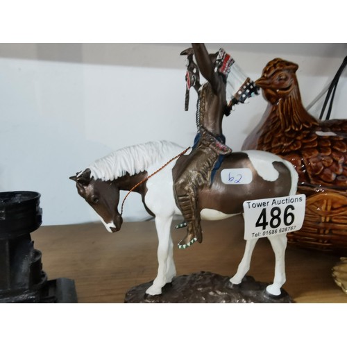 486 - An open top tram made of coal along with a metal horse figure with Indian titled 