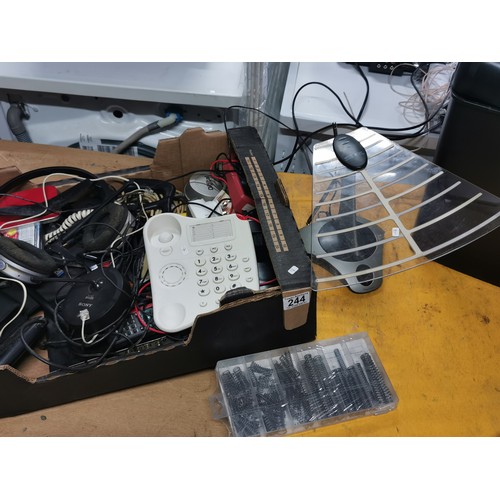 244 - A box of electrical items including an amazon basic shredder a Sony wireless aerial, telephones, hea... 