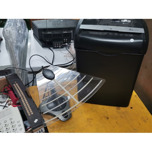 244 - A box of electrical items including an amazon basic shredder a Sony wireless aerial, telephones, hea... 