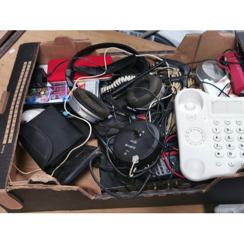 244 - A box of electrical items including an amazon basic shredder a Sony wireless aerial, telephones, hea... 