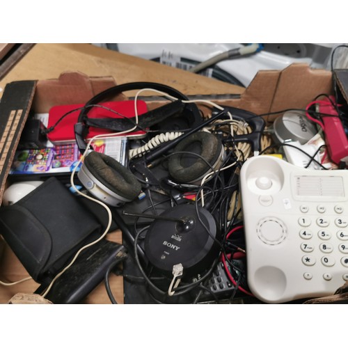 244 - A box of electrical items including an amazon basic shredder a Sony wireless aerial, telephones, hea... 