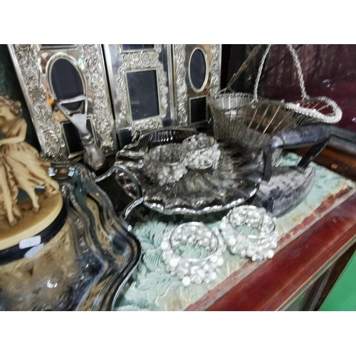 497 - A quantity of plated ware including a plated butlers tray, two large scalloped form dishes, a set of... 
