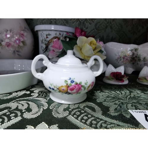 495 - A quantity of collectable china including vases, pin dishes, lidded pots etc. By Aynsley Leonardo co... 