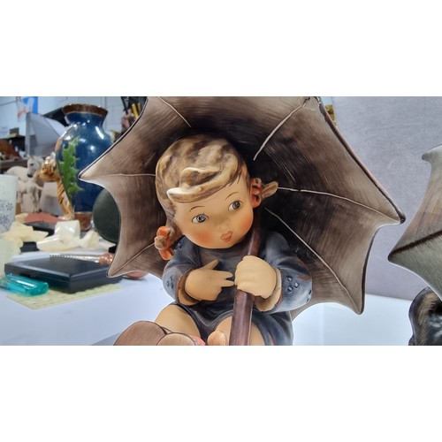 493 - Pair of rare matching Goebel Hummel Boy and Girl under umbrella figures 152/0A & 152/0B both dated 1... 