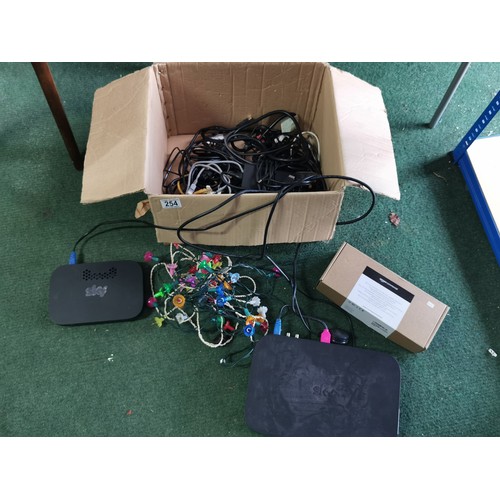 254 - A quantity of electrical items including electric cables, sky boxes an amazon AC clamp metre and a q... 