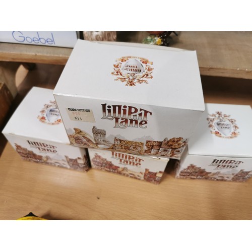 506 - A quantity of eight lilliput lane cottages including Mrs Pinkertons post office, oak cottage, Kentis... 