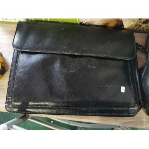 263 - A quantity of leather items including an antler laptop bag, work satchel bag, 2 pairs of size 10 hob... 