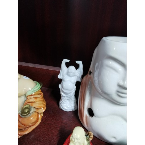 513 - A quantity of Buddhas of varying sizes including a tealight Buddha, a jade Buddha on stand, resins B... 
