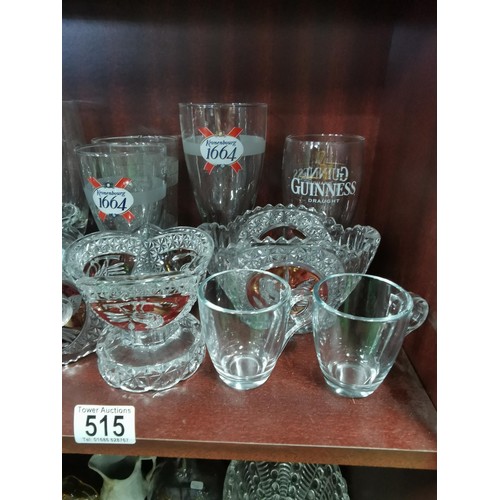 515 - a large quantity of glassware including five Grolsch lager glasses, Kronenbourg, Guinness and an orn... 