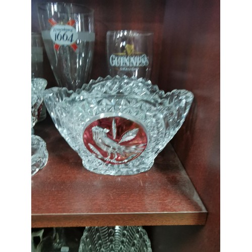 515 - a large quantity of glassware including five Grolsch lager glasses, Kronenbourg, Guinness and an orn... 