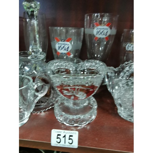 515 - a large quantity of glassware including five Grolsch lager glasses, Kronenbourg, Guinness and an orn... 