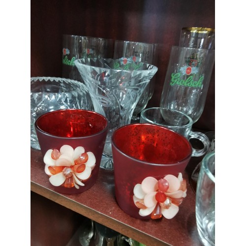 515 - a large quantity of glassware including five Grolsch lager glasses, Kronenbourg, Guinness and an orn... 
