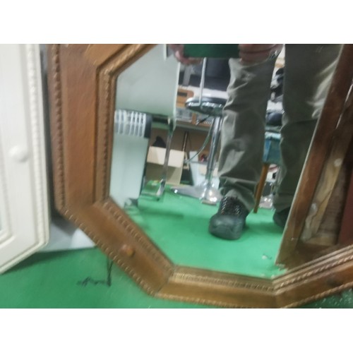 517 - Two antique wooden framed bevel edged mirrors.
Largest measures 52sq.