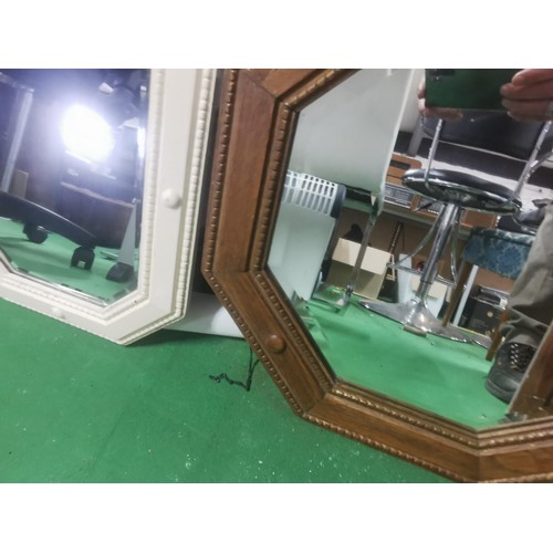 517 - Two antique wooden framed bevel edged mirrors.
Largest measures 52sq.