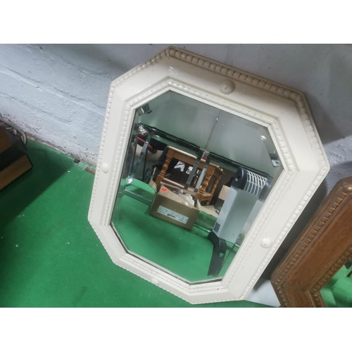 517 - Two antique wooden framed bevel edged mirrors.
Largest measures 52sq.