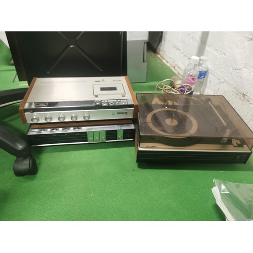 521 - A Philips three deck system including amplifier, cassette player and record deck. Complete with cabl... 